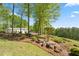 View of the detached garage with landscaping at 922 Florence Rd, Douglasville, GA 30134