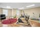 Home gym with multiple exercise machines, wood floors, and recessed lighting at 922 Florence Rd, Douglasville, GA 30134