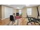 A home gym with wood floors, natural light, and workout equipment at 922 Florence Rd, Douglasville, GA 30134