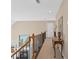 Hallway features wood banister and staircase, a decorative table, and access to a fireplace in the living room at 922 Florence Rd, Douglasville, GA 30134