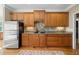 Functional kitchen featuring abundant wood cabinetry and stainless steel refrigerator at 922 Florence Rd, Douglasville, GA 30134