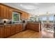 Kitchen featuring wooden cabinets, stainless steel appliances, and an adjacent breakfast nook at 922 Florence Rd, Douglasville, GA 30134