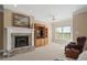 Living room with brick fireplace, large windows, and a built-in entertainment center at 922 Florence Rd, Douglasville, GA 30134