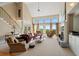 Spacious living room with vaulted ceilings, lots of natural light, fireplace and comfortable seating area at 922 Florence Rd, Douglasville, GA 30134