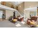 Inviting living room featuring a soaring ceiling, open staircase, and comfortable seating arrangement at 922 Florence Rd, Douglasville, GA 30134