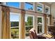 Living room with large windows showcasing beautiful views and draperies at 922 Florence Rd, Douglasville, GA 30134