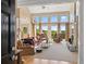 Welcoming living room with soaring ceilings, large windows and cozy fireplace, perfect for relaxation at 922 Florence Rd, Douglasville, GA 30134