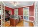 Home office featuring a hardwood floor, a ceiling fan and lots of natural light at 922 Florence Rd, Douglasville, GA 30134