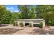 Large outbuilding with two garage doors, providing ample space for storage or workshop at 922 Florence Rd, Douglasville, GA 30134