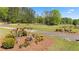 Scenic view of the expansive property, featuring manicured lawns, trees, and lush greenery at 922 Florence Rd, Douglasville, GA 30134