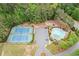 A top-down view of community amenities including a pool, tennis courts, and green space, offering recreational opportunities at 1039 Avery Creek Dr, Woodstock, GA 30188