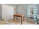 A well-lit bedroom featuring a large closet and a wooden desk, perfect for a home office or study space at 1039 Avery Creek Dr, Woodstock, GA 30188