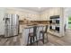 Well-equipped kitchen featuring stainless steel appliances, granite countertops, and center island with seating at 1039 Avery Creek Dr, Woodstock, GA 30188