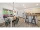 Bright kitchen featuring updated appliances, ample cabinets, island and eat-in area at 1039 Avery Creek Dr, Woodstock, GA 30188