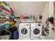 Laundry Room features a washer, dryer, shelving with items at 1039 Avery Creek Dr, Woodstock, GA 30188