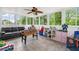 Sunroom offering lots of natural light with windows and a ceiling fan at 1039 Avery Creek Dr, Woodstock, GA 30188