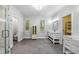 Bright bathroom with double vanity sinks, large shower and stylish gray tile flooring at 1492 Frazier Rd, Decatur, GA 30033