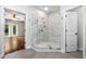 Bathroom boasts marble shower, stylish gray flooring, and access to the bedroom at 1492 Frazier Rd, Decatur, GA 30033