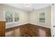 Cozy bedroom featuring hardwood floors and bright natural light at 1492 Frazier Rd, Decatur, GA 30033