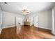 Spacious bedroom with hardwood floors, ceiling fan and an ensuite bathroom and walk-in closet at 1492 Frazier Rd, Decatur, GA 30033
