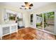 Open breakfast nook with tile floors, white cabinetry, and a view to the backyard at 1492 Frazier Rd, Decatur, GA 30033