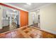 Open dining area with tile flooring leading into a kitchen and hallway at 1492 Frazier Rd, Decatur, GA 30033