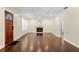 Open living room with hardwood floors, a fireplace, and natural light at 1492 Frazier Rd, Decatur, GA 30033