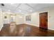 Spacious living room featuring hardwood floors, coffered ceilings, and a decorative fireplace at 1492 Frazier Rd, Decatur, GA 30033