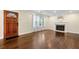 Bright living room with hardwood floors, fireplace, and large windows at 1492 Frazier Rd, Decatur, GA 30033