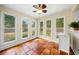 A bright sunroom featuring tile flooring, large windows, and natural light at 1492 Frazier Rd, Decatur, GA 30033