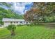 A well-maintained backyard features a grassy lawn, mature trees, and a partial view of the home's exterior at 2685 Harrington Dr, Decatur, GA 30033
