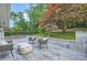 Charming backyard with a patio and seating area surrounded by lush greenery and mature trees at 2685 Harrington Dr, Decatur, GA 30033