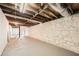 Unfinished basement area with painted brick walls and exposed ceiling at 2685 Harrington Dr, Decatur, GA 30033