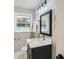 Stylish bathroom with black vanity and modern light fixture at 2685 Harrington Dr, Decatur, GA 30033