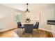 Cozy dining room with modern chandelier and seating for four at 2685 Harrington Dr, Decatur, GA 30033