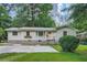 Charming single-story home with stone foundation and meticulously manicured lawn at 2685 Harrington Dr, Decatur, GA 30033