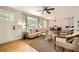 Open-concept living room with hardwood floors, natural light, and stylish furniture at 2685 Harrington Dr, Decatur, GA 30033