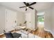 Versatile home office with modern desk, hardwood floors, and access to both interior and exterior spaces at 2685 Harrington Dr, Decatur, GA 30033