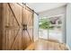 Inviting patio features wooden barn doors leading to outdoor space with a table and chairs at 2685 Harrington Dr, Decatur, GA 30033