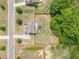 Aerial view of a well-maintained property featuring a spacious yard, mature trees, and privacy fencing at 432 Creekside Park, Covington, GA 30014