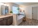 En Suite bathroom featuring double vanity, separate tub and shower, and wood-look tile flooring at 432 Creekside Park, Covington, GA 30014