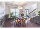 Stylish dining room with modern lighting, a glass table, and hardwood floors, perfect for gatherings at 432 Creekside Park, Covington, GA 30014