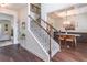 Elegant foyer with staircase, hardwood floors, and dining area, creating a grand entrance at 432 Creekside Park, Covington, GA 30014