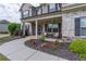 Inviting front porch with seating and landscaping offering a cozy spot to relax and enjoy the outdoors at 432 Creekside Park, Covington, GA 30014