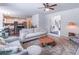 Bright and open living room with a view of the kitchen and dining area, creating a seamless flow for entertaining at 432 Creekside Park, Covington, GA 30014