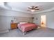 Large primary bedroom with tray ceilings, ceiling fan, and lots of natural light at 432 Creekside Park, Covington, GA 30014