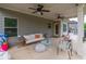 Covered back patio with outdoor furniture and ceiling fans at 432 Creekside Park, Covington, GA 30014