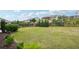 Large grassy backyard with a dark wood fence that lines the property's perimeter at 4615 Elmwood Trl, Cumming, GA 30028