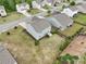 Aerial view of the backyard showing green grass, landscaping, fencing, and the back of the house at 4615 Elmwood Trl, Cumming, GA 30028