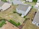 Aerial view of the backyard showing green grass, landscaping, fencing, and the back of the house at 4615 Elmwood Trl, Cumming, GA 30028